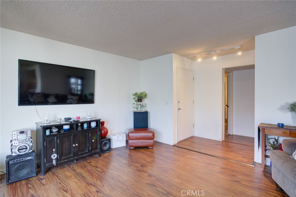 1165 Maple Street, Unit E Arroyo Grande, CA 93420 - Photo 11 of 50 a living room with furniture and a flat screen tv
