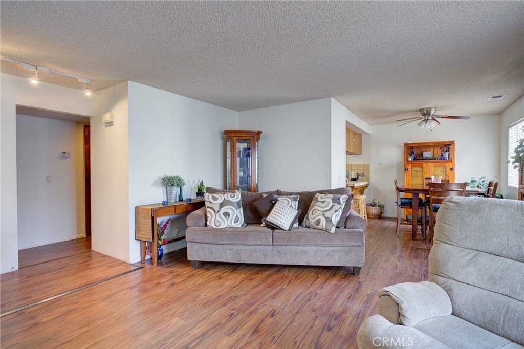 1165 Maple Street, Unit E Arroyo Grande, CA 93420 - Photo 12 of 50 a living room with furniture and a wooden floor