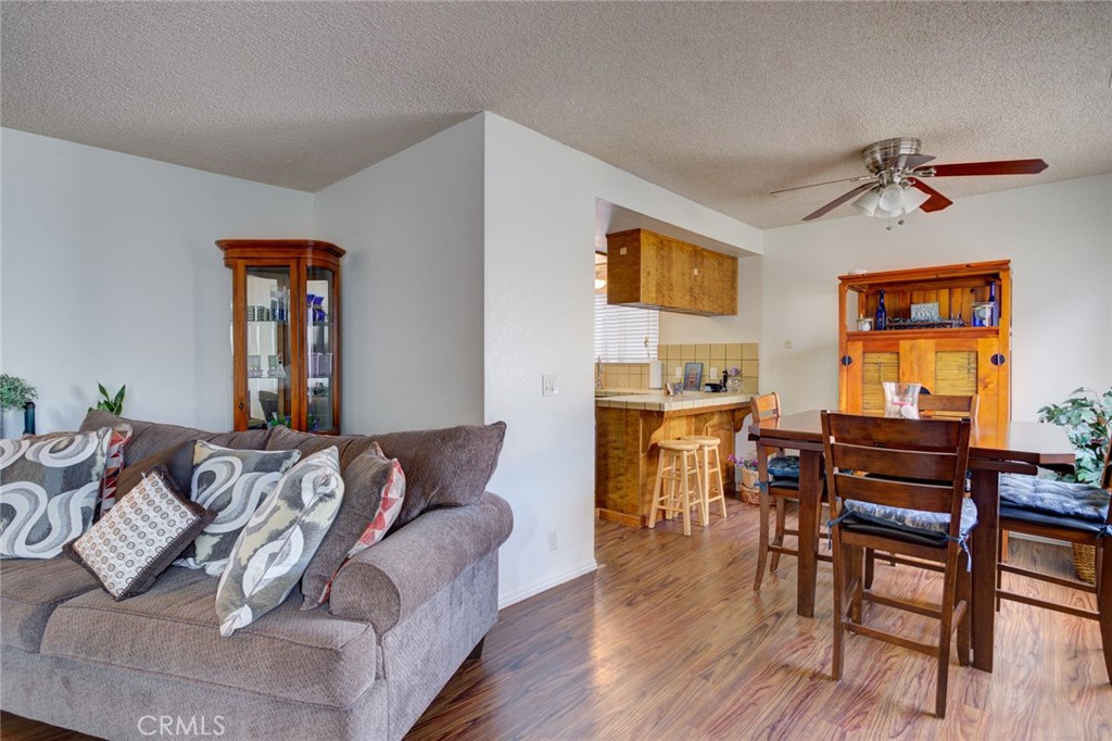 1165 Maple Street, Unit E Arroyo Grande, CA 93420 - Photo 13 of 50 a living room with furniture and a wooden floor
