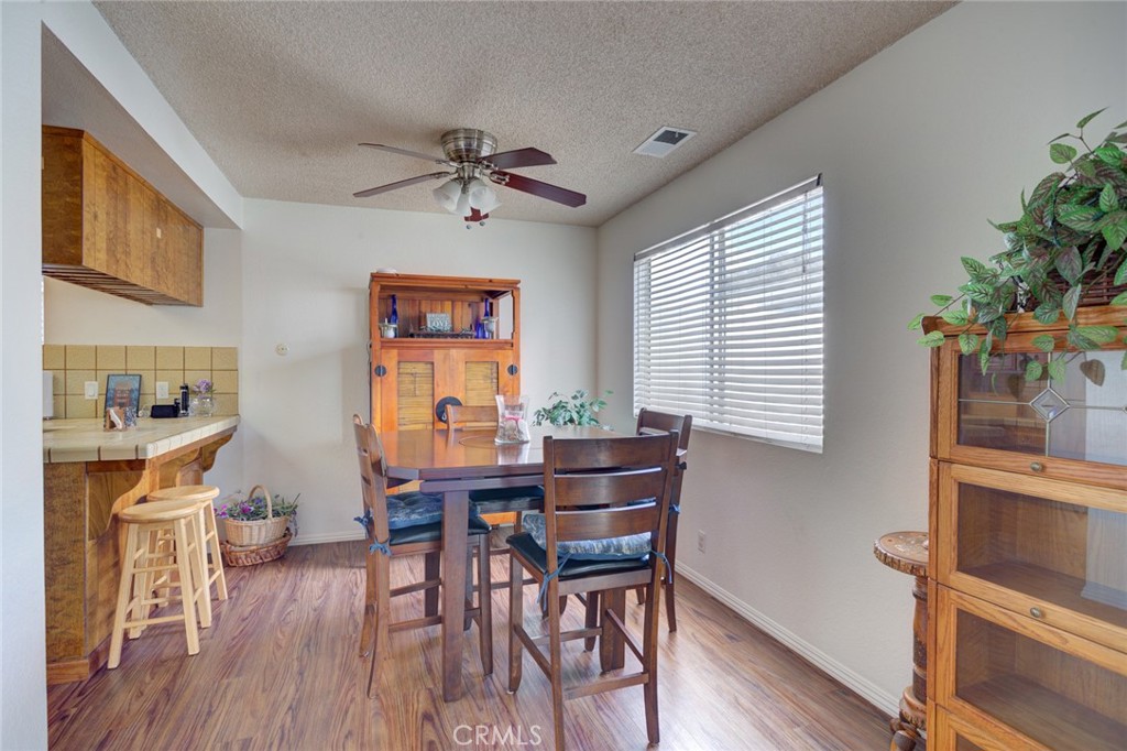 1165 Maple Street, Unit E Arroyo Grande, CA 93420 - Photo 14 of 50 a view of a dining room with furniture window and wooden floor