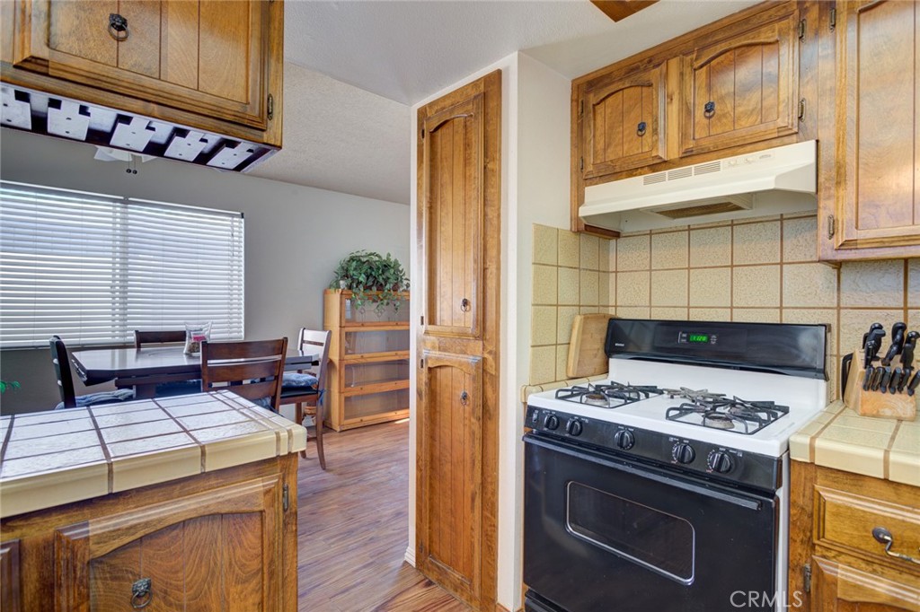 1165 Maple Street, Unit E Arroyo Grande, CA 93420 - Photo 19 of 50 a kitchen with a stove and a refrigerator