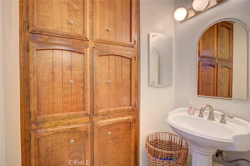 1165 Maple Street, Unit E Arroyo Grande, CA 93420 - Photo 24 of 50 a bathroom with a sink and a mirror