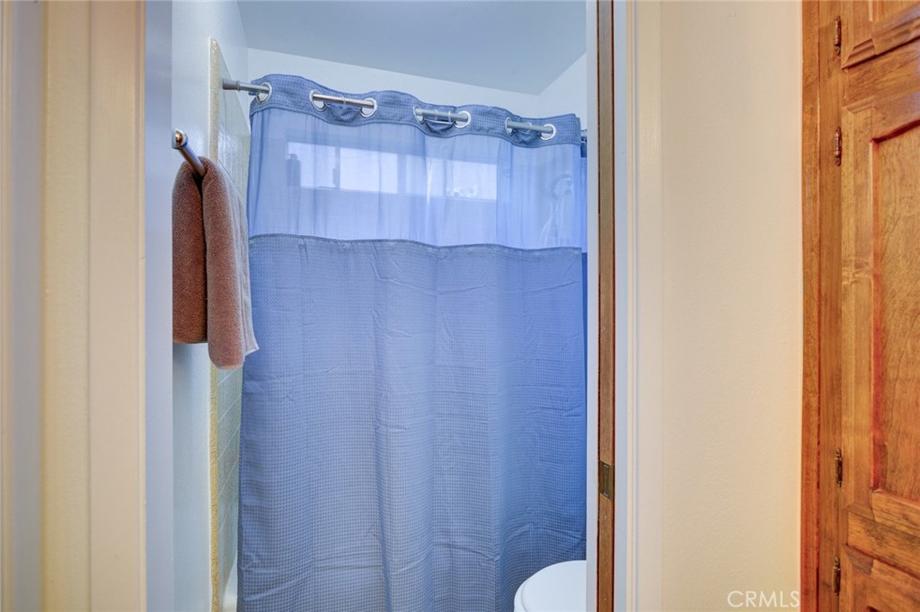 1165 Maple Street, Unit E Arroyo Grande, CA 93420 - Photo 25 of 50 a bathroom with a shower and a sink