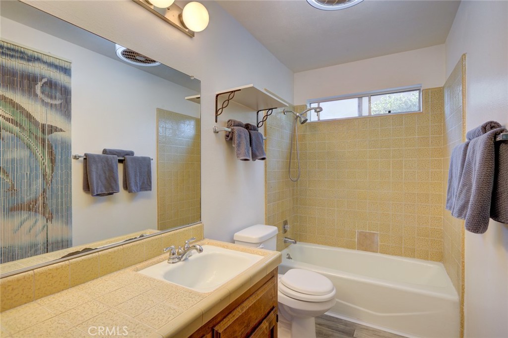 1165 Maple Street, Unit E Arroyo Grande, CA 93420 - Photo 29 of 50 a bathroom with a sink toilet and shower