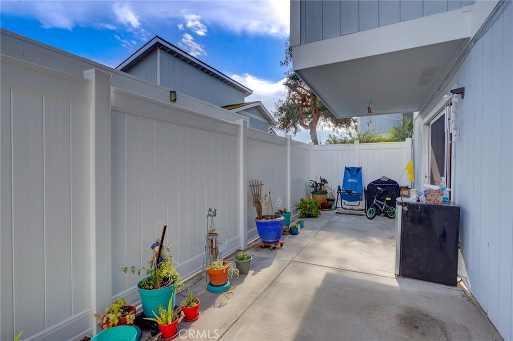 1165 Maple Street, Unit E Arroyo Grande, CA 93420 - Photo 35 of 50 a view of living room filled with furniture and a chandelier
