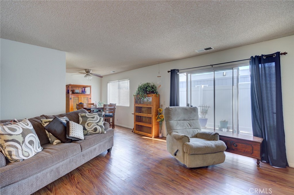 1165 Maple Street, Unit E Arroyo Grande, CA 93420 - Photo 9 of 50 a living room with furniture and wooden floor