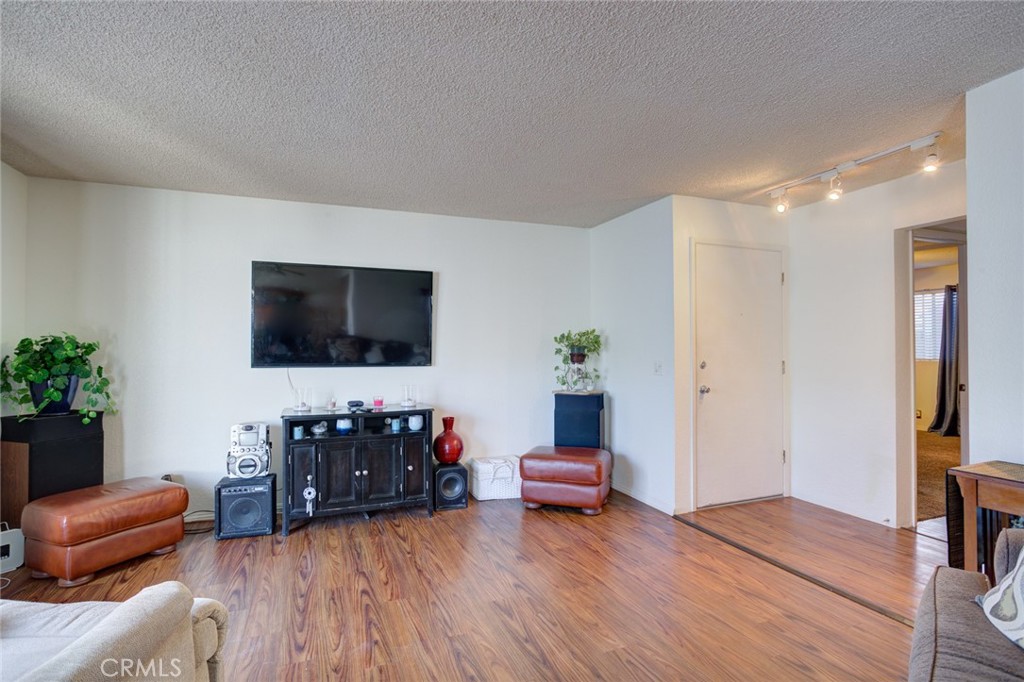 1165 Maple Street, Unit E Arroyo Grande, CA 93420 - Photo 10 of 50 a living room with furniture and a flat screen tv
