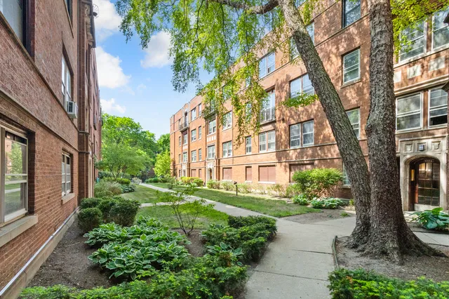 a view of a building with a garden