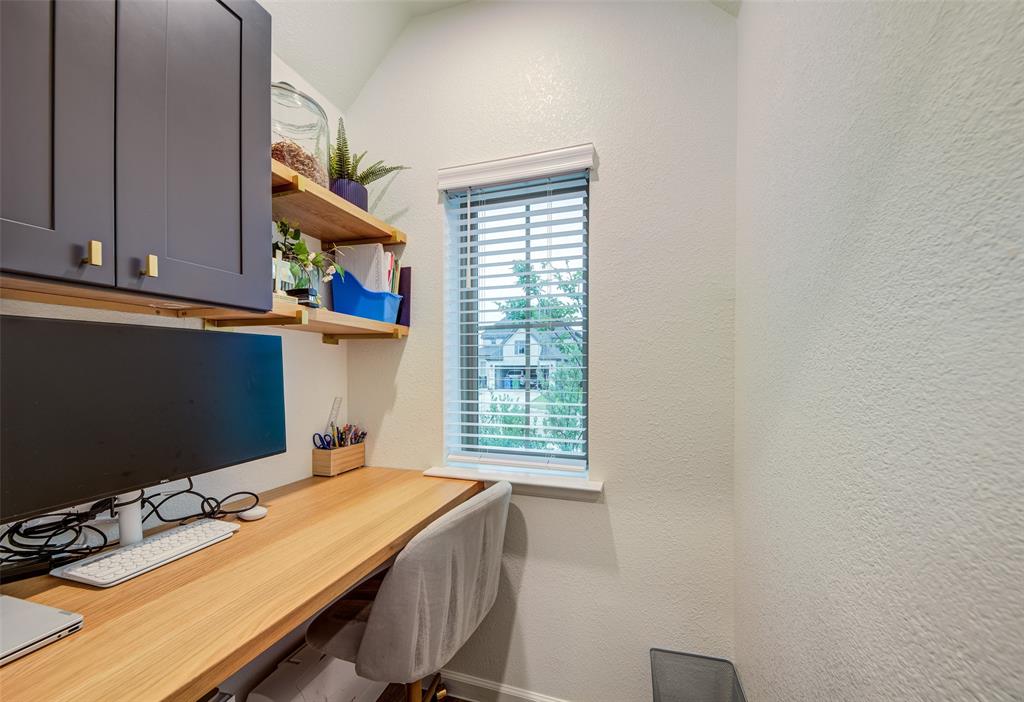 162 Palo Duro Bend Rhome, TX 76078 - Photo 21 of 25 Office nook with soft close cabinetry and built in desk & shelves