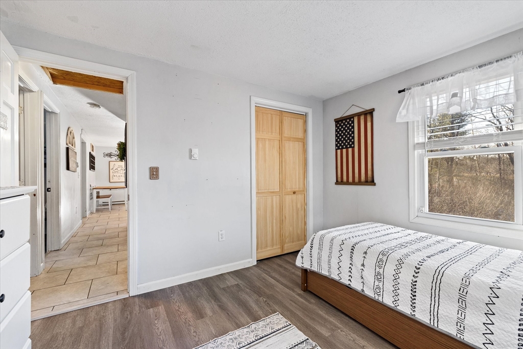 514 West Street Gardner, MA 01440 - Photo 15 of 37 a bedroom with a bed and a window