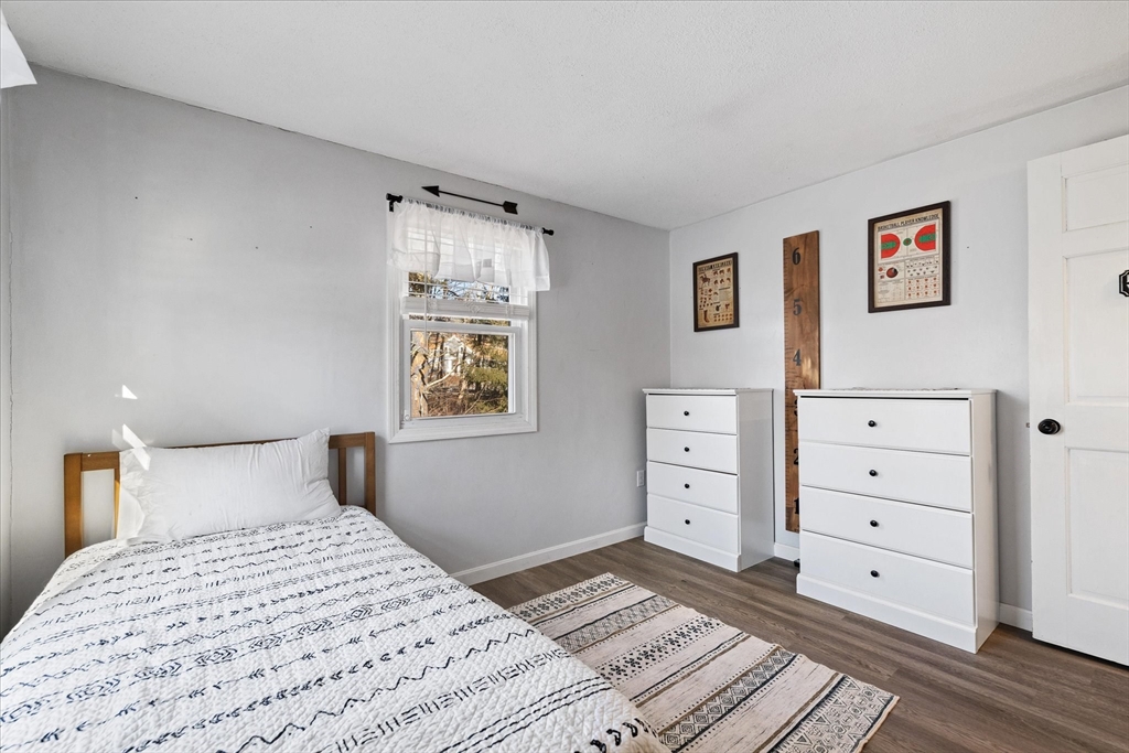 514 West Street Gardner, MA 01440 - Photo 16 of 37 a bedroom with a bed and a cabinets