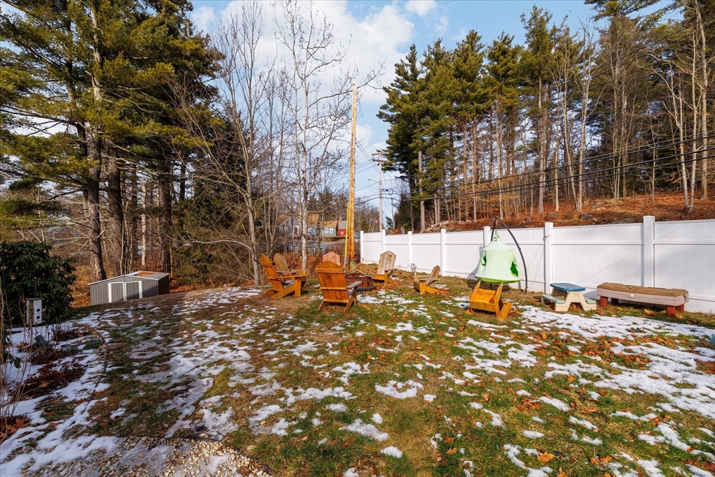 514 West Street Gardner, MA 01440 - Photo 27 of 37 a backyard of a house with large trees