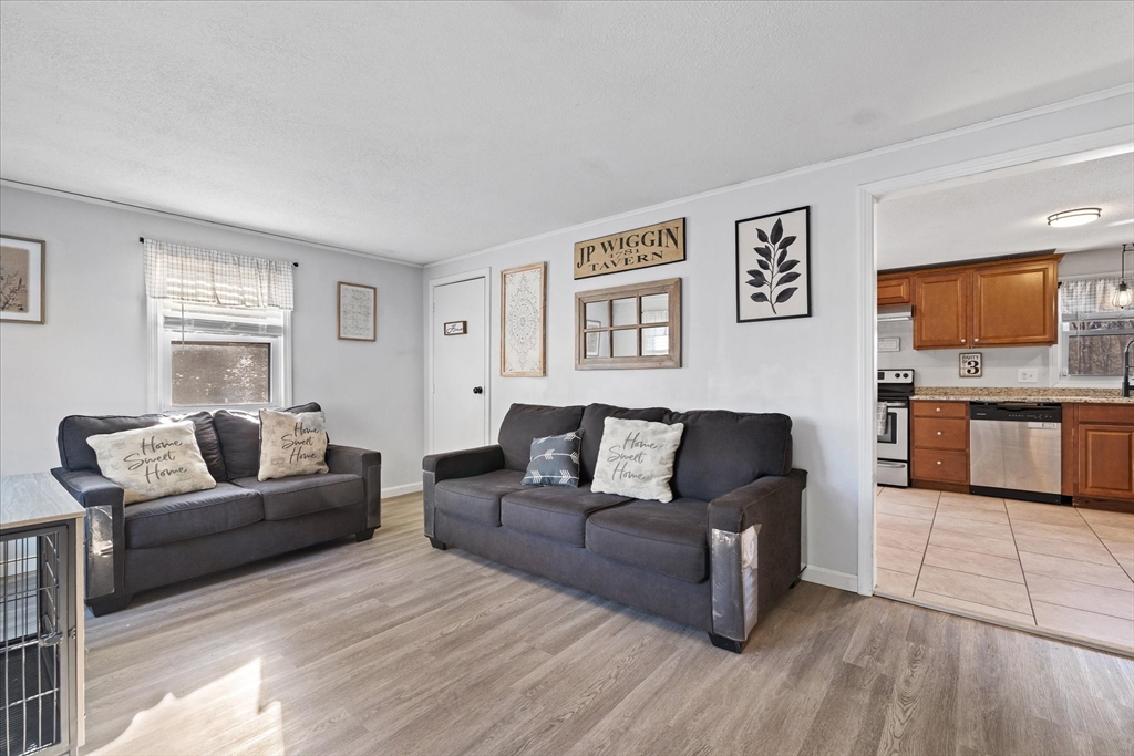 514 West Street Gardner, MA 01440 - Photo 4 of 37 a living room with furniture and a flat screen tv