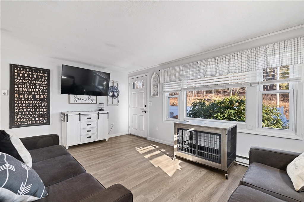 514 West Street Gardner, MA 01440 - Photo 5 of 37 a living room with furniture and a flat screen tv