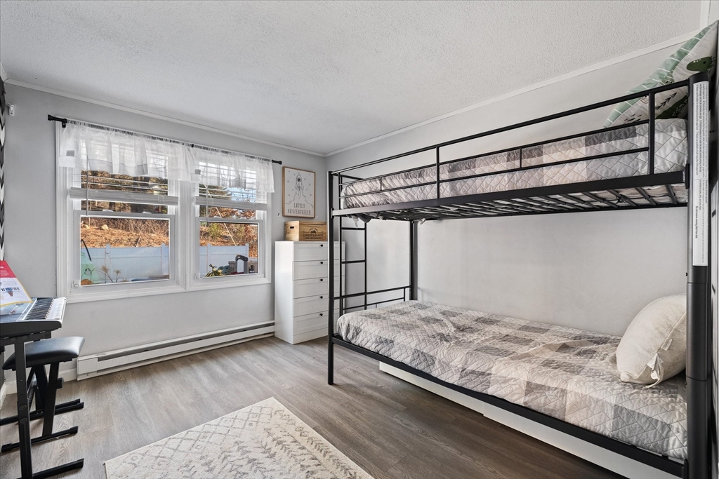 514 West Street Gardner, MA 01440 - Photo 10 of 37 a bedroom with a bed and a window