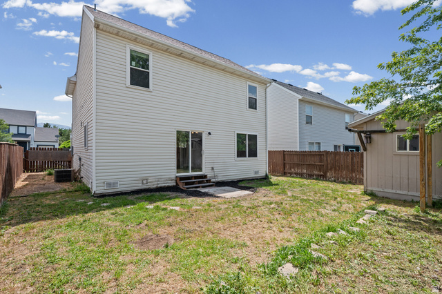 1346 Archmore Drive Springville, UT 84663 - Photo 25 of 32 Two-story siding exterior featuring multiple windows and a sliding glass door