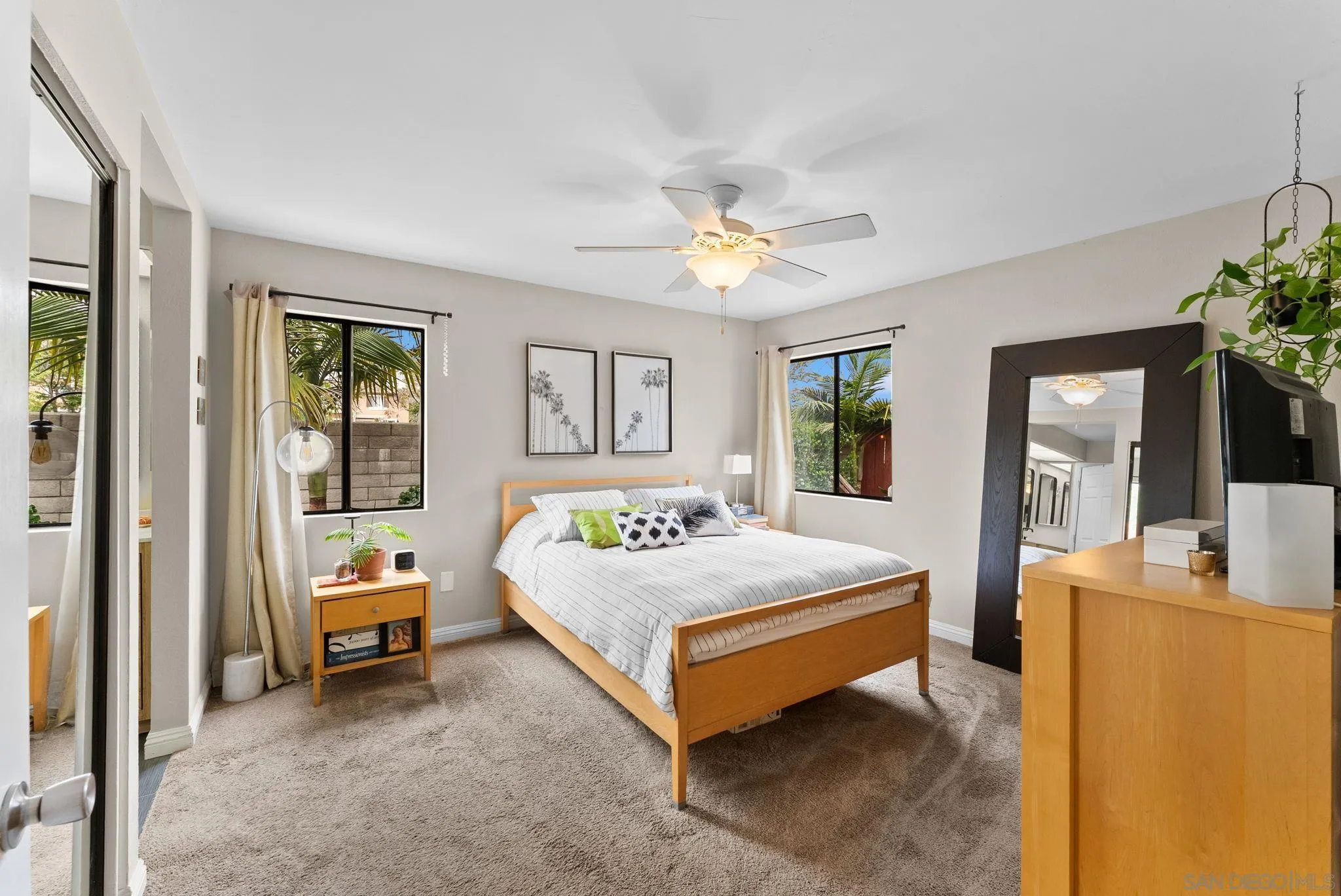 4444 Silver Birch Way Oceanside, CA 92057 - Photo 14 of 54 a spacious bedroom with a bed and a chandelier