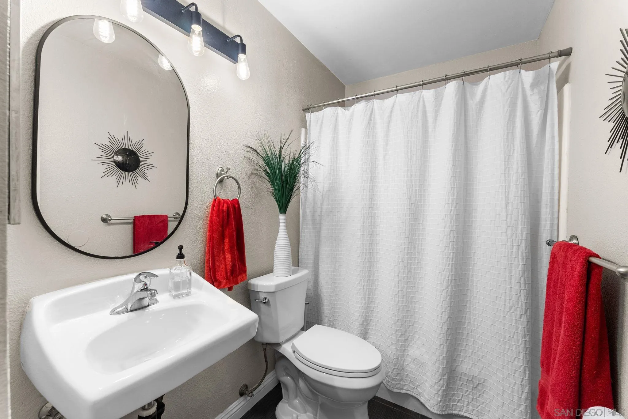 4444 Silver Birch Way Oceanside, CA 92057 - Photo 21 of 54 a bathroom with a sink vanity mirror and toilet