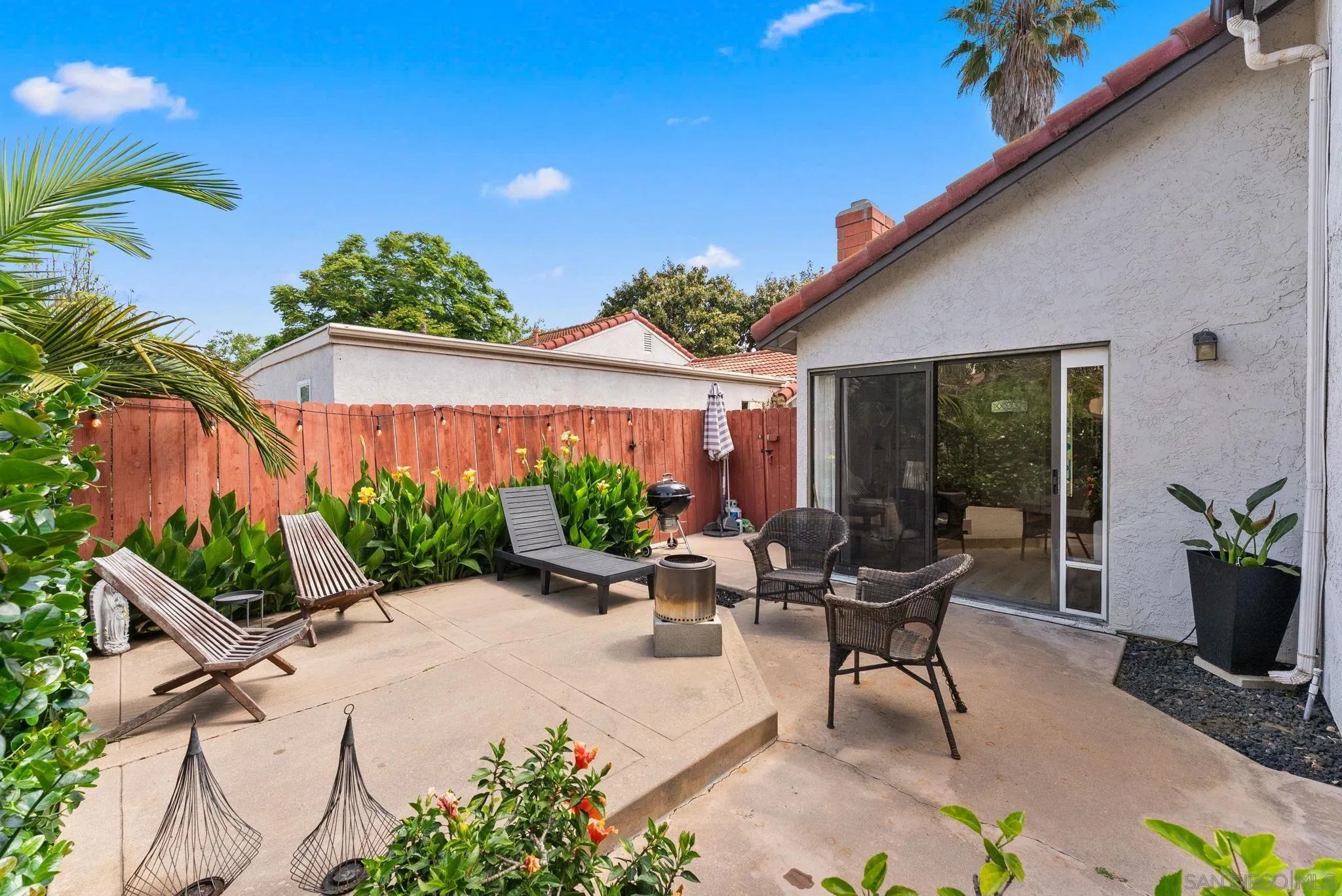 4444 Silver Birch Way Oceanside, CA 92057 - Photo 29 of 54 a view of a house with backyard sitting area and garden