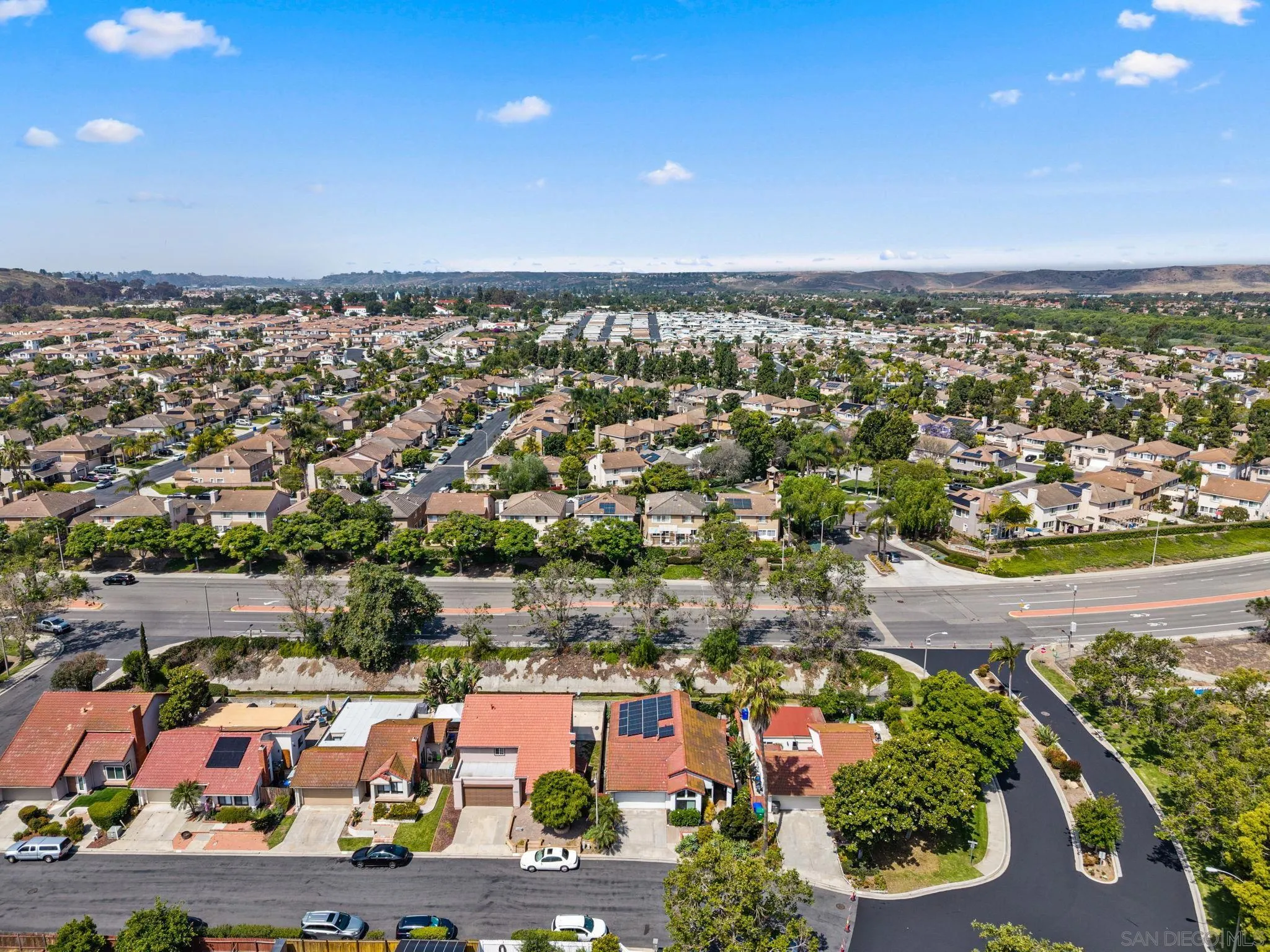 4444 Silver Birch Way Oceanside, CA 92057 - Photo 45 of 54 an aerial view of a city with lots of residential buildings ocean and mountain view in back