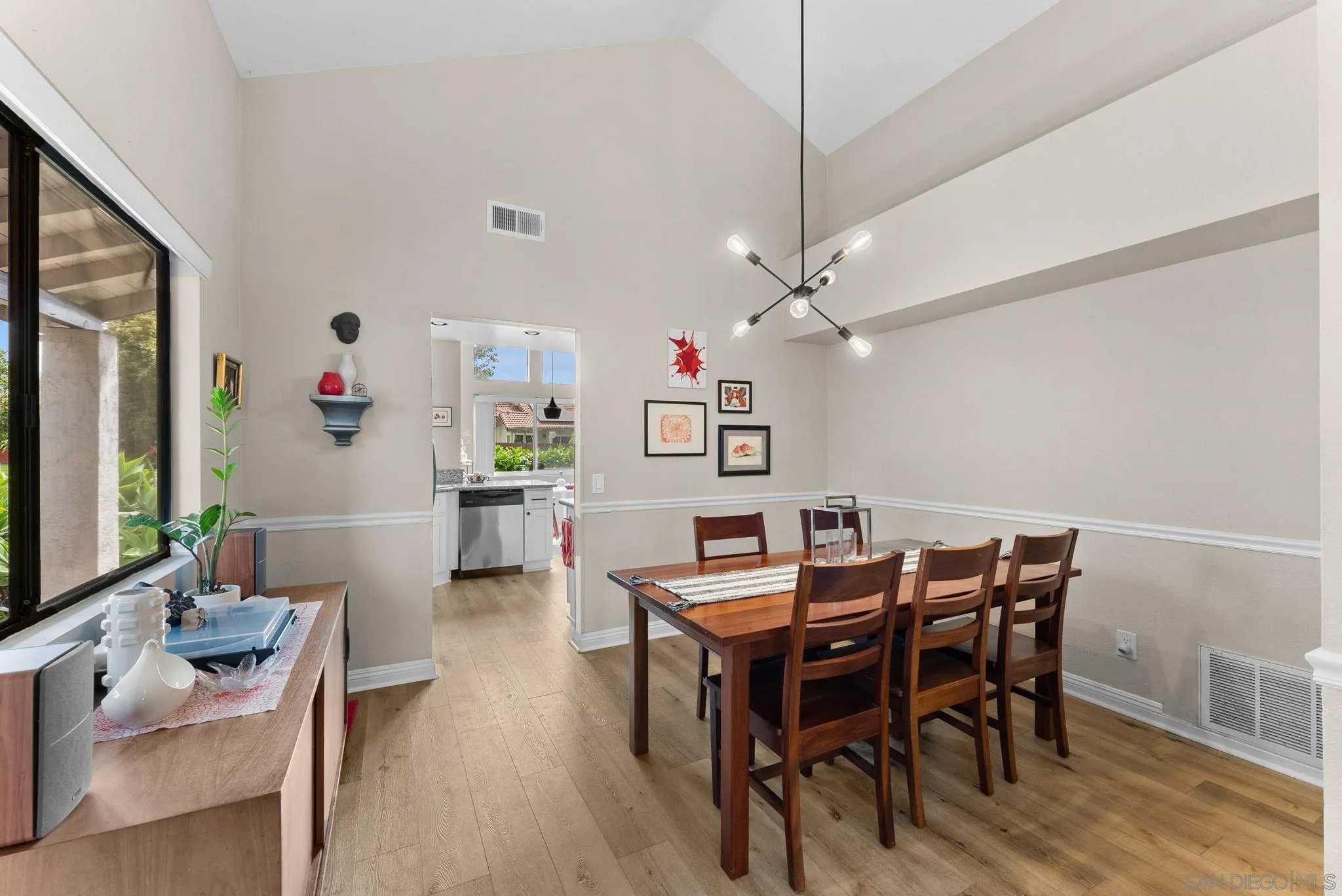 4444 Silver Birch Way Oceanside, CA 92057 - Photo 8 of 54 a view of a dining room with furniture and wooden floor