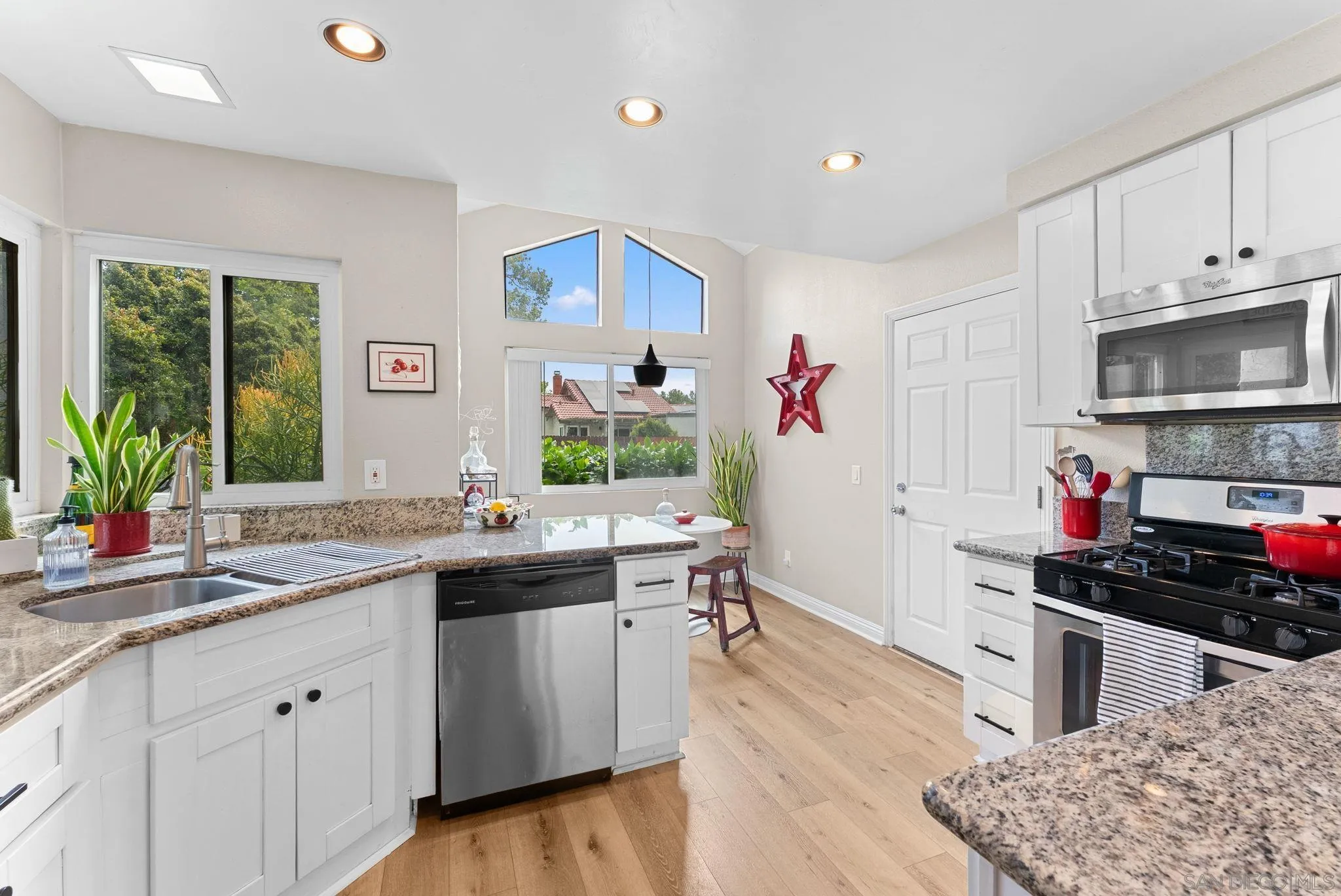 4444 Silver Birch Way Oceanside, CA 92057 - Photo 10 of 54 a kitchen with a sink stove and cabinets