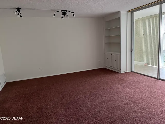 a view of a room with large windows