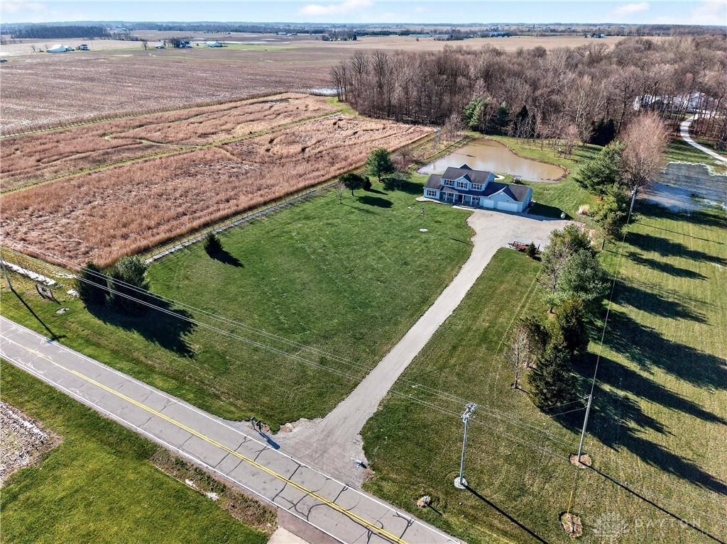 6560 Snyder Road Fletcher, OH 45326 - Photo 65 of 71 This expansive estate features a charming residence, a serene pond, and lush green spaces.
