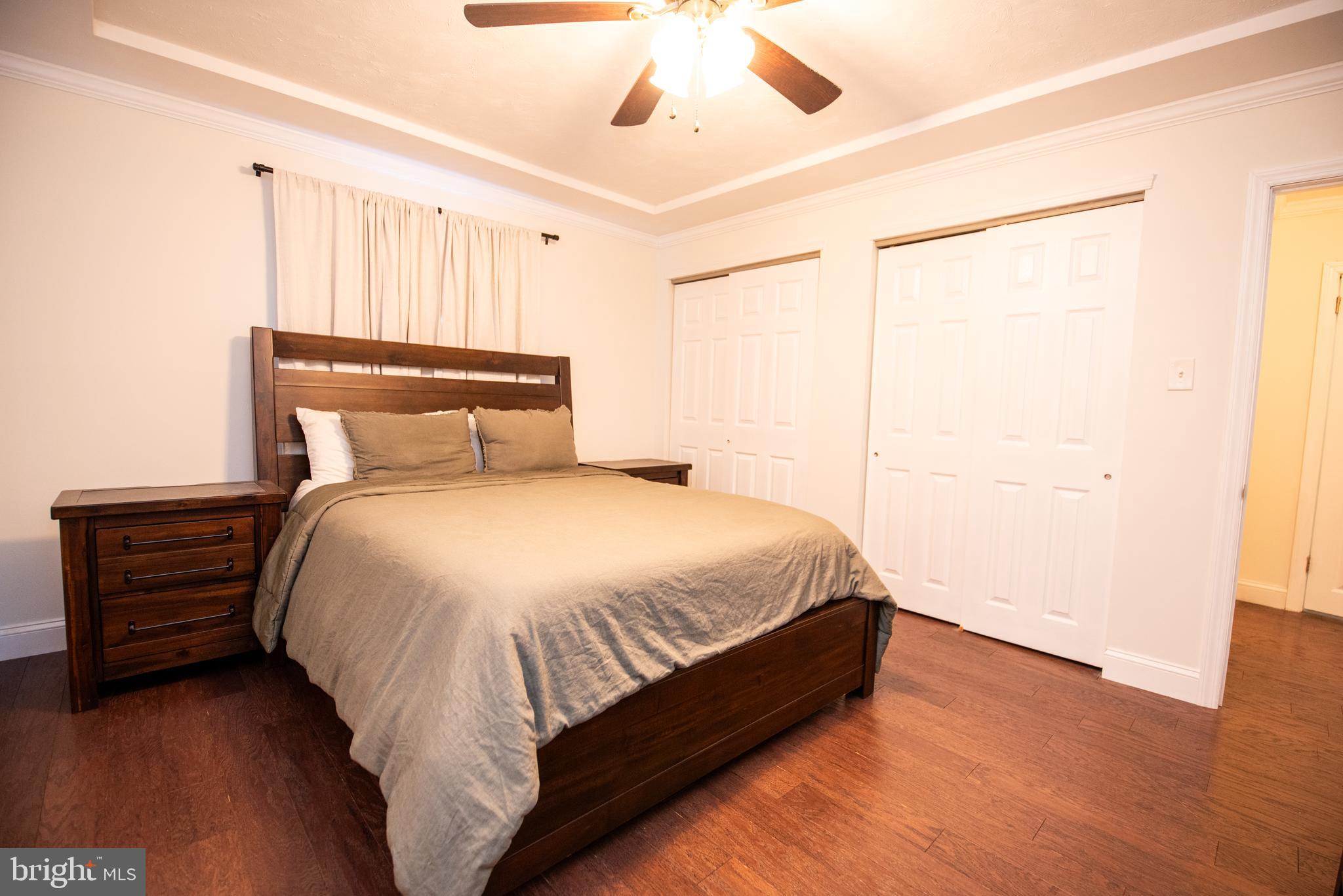 452 Elm Avenue Maple Shade, NJ 08052 - Photo 14 of 31 a bed sitting in a bedroom next to a window