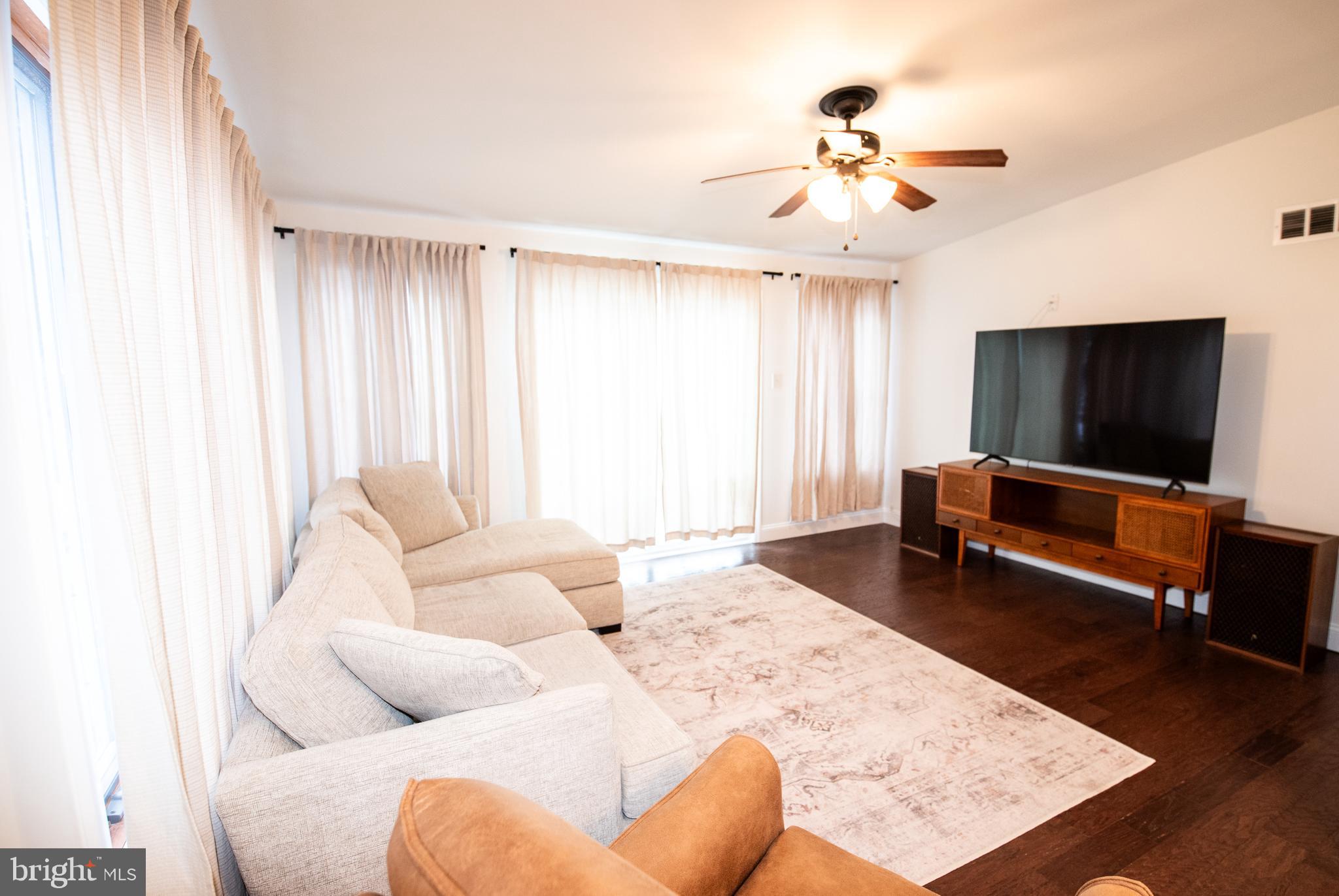 452 Elm Avenue Maple Shade, NJ 08052 - Photo 16 of 31 a living room with furniture and a flat screen tv