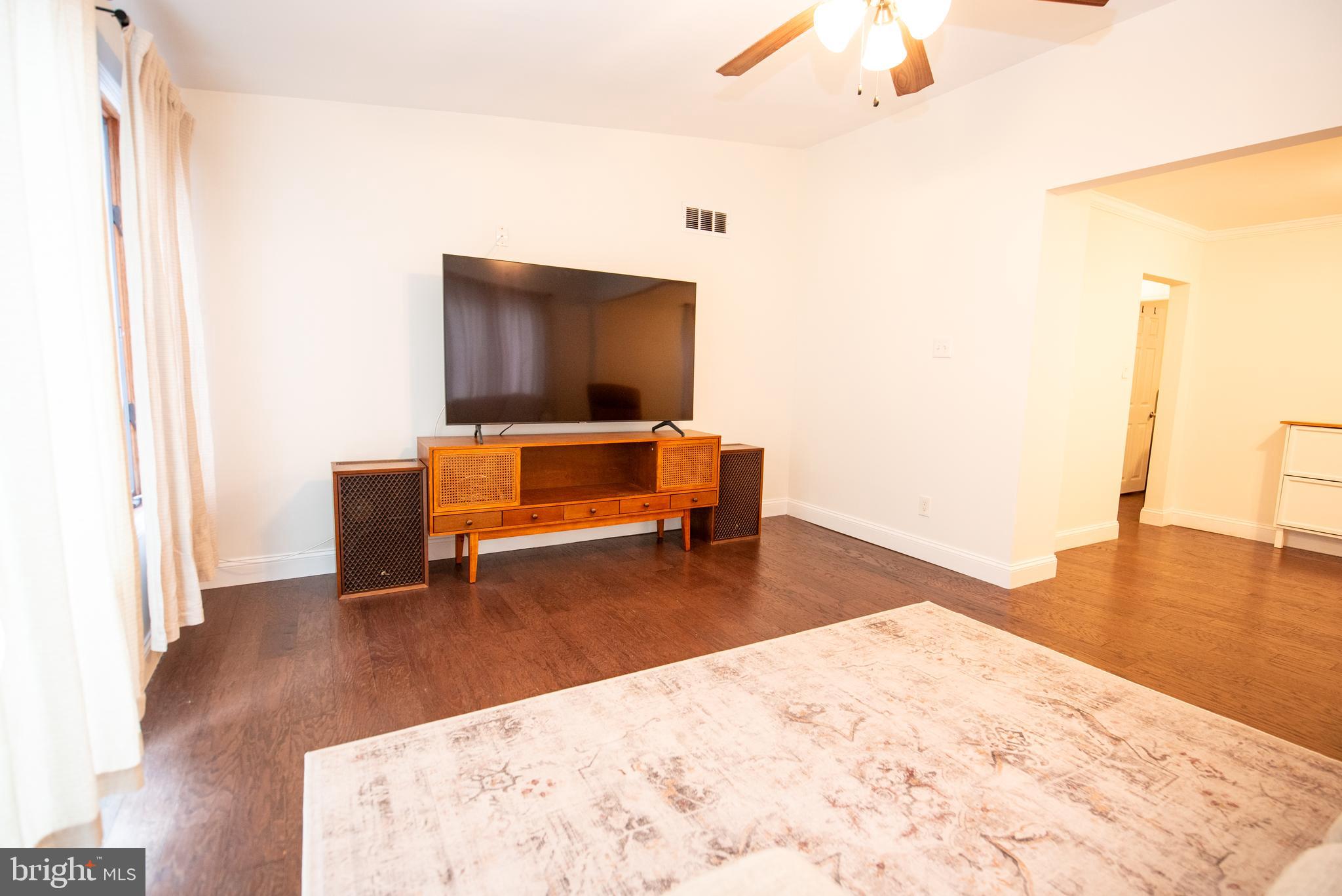 452 Elm Avenue Maple Shade, NJ 08052 - Photo 18 of 31 a living room with furniture and a flat screen tv