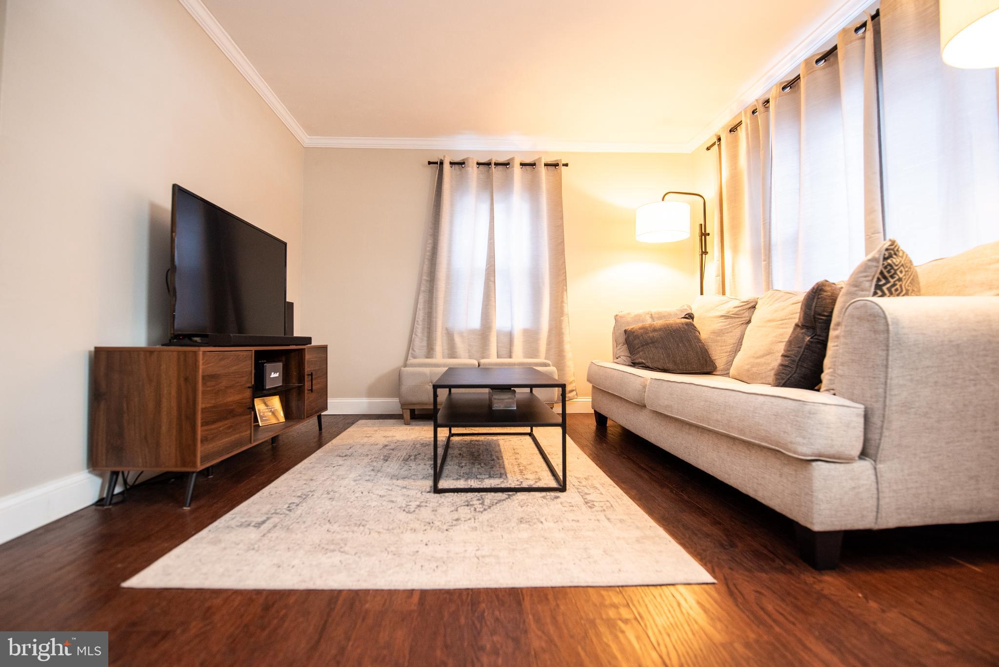 452 Elm Avenue Maple Shade, NJ 08052 - Photo 5 of 31 a living room with furniture and a flat screen tv