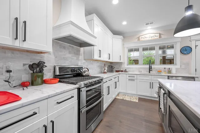 a large kitchen with stainless steel appliances lots of counter space