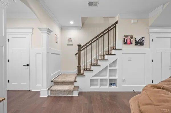 a living room with furniture and flowers