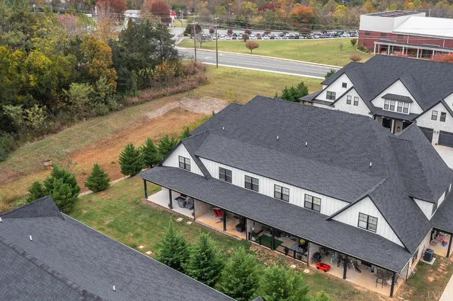 a room with stainless steel appliances lots of counter space dining table and chairs