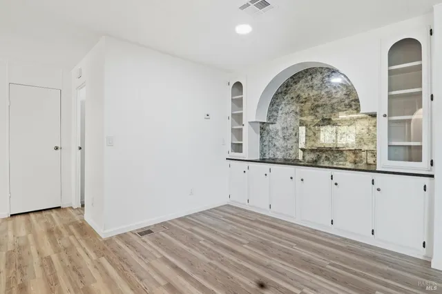 a view of a livingroom with wooden floor