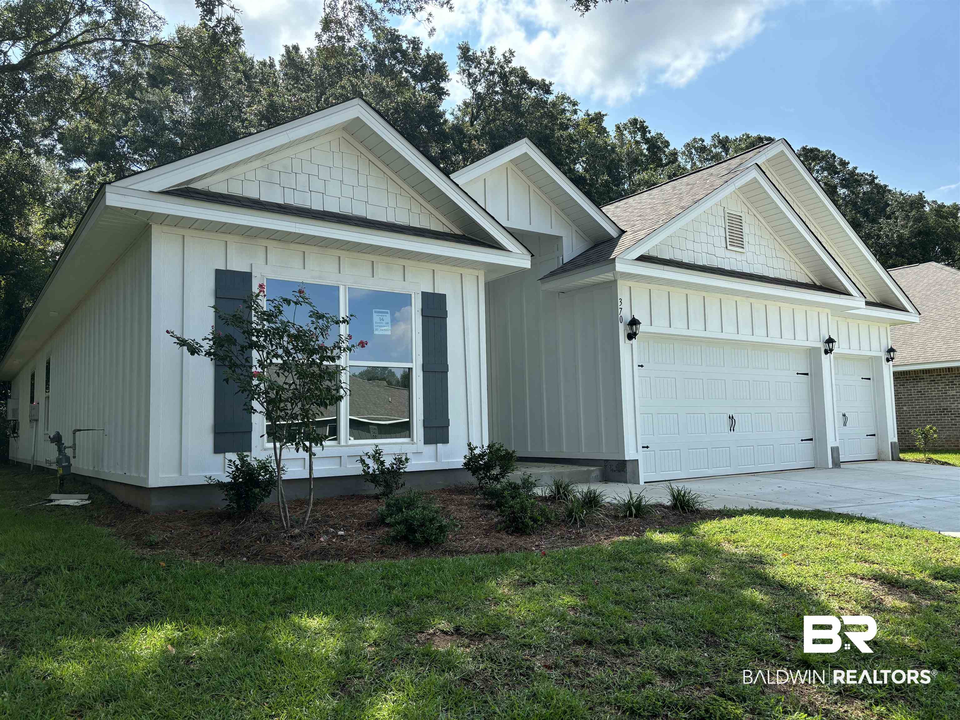 370 Barndling Street Fairhope, AL 36532 - Photo 2 of 30 View of front facade with a garage and a front yard