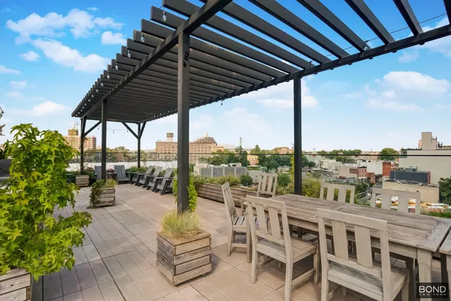 a view of roof deck with patio
