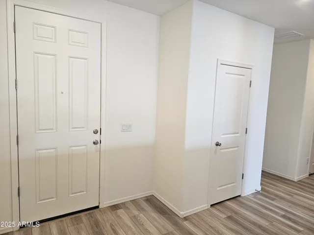 a view of a livingroom with wooden floor