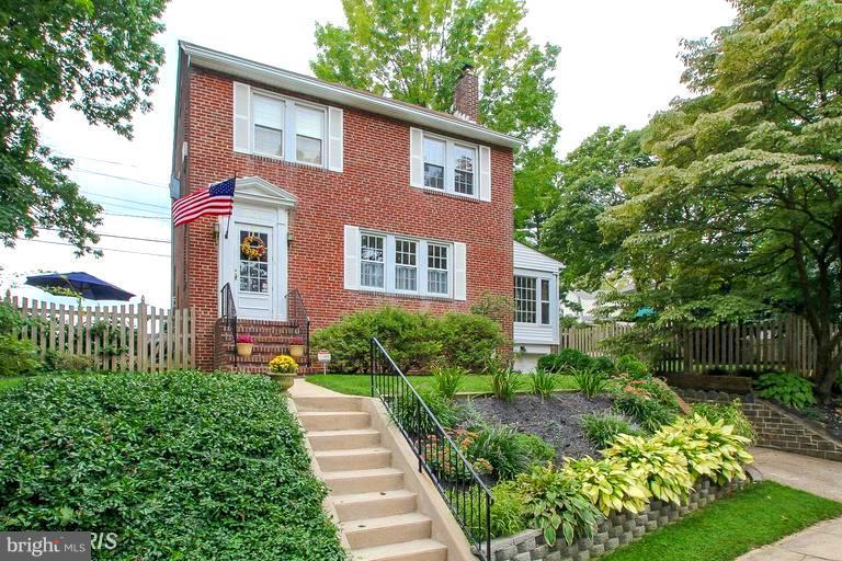 308 Kingston Road Baltimore, MD 21229 - Photo 1 of 30 a front view of a house with a garden