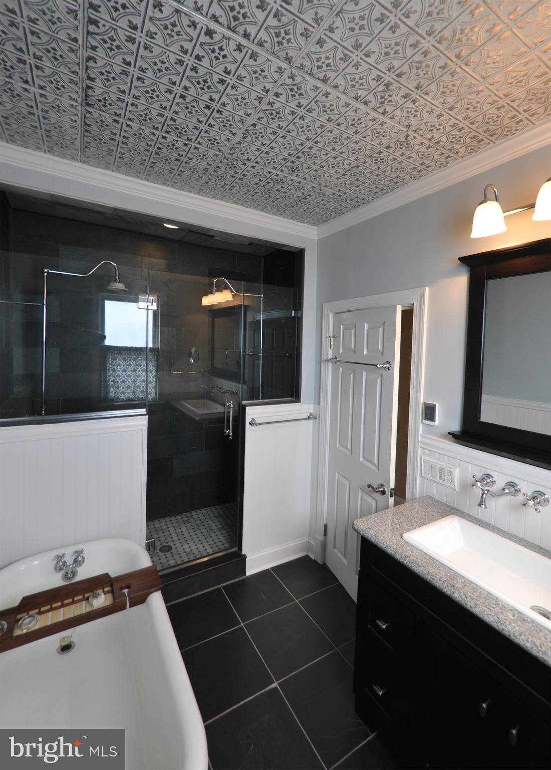 308 Kingston Road Baltimore, MD 21229 - Photo 12 of 30 a bathroom with a sink and a mirror