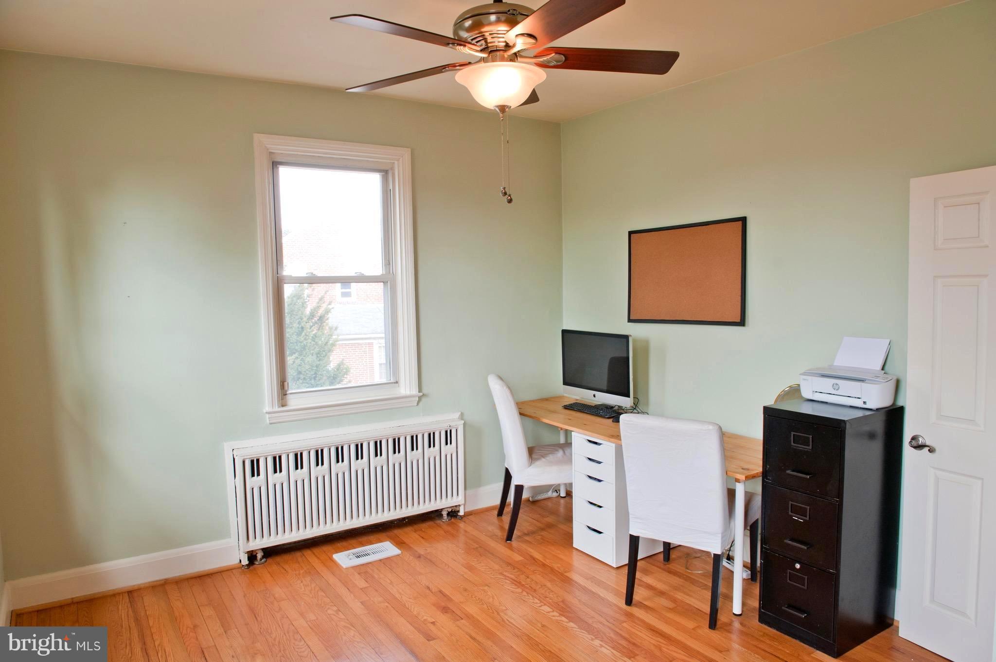 308 Kingston Road Baltimore, MD 21229 - Photo 18 of 30 a view of a workspace with furniture and a window