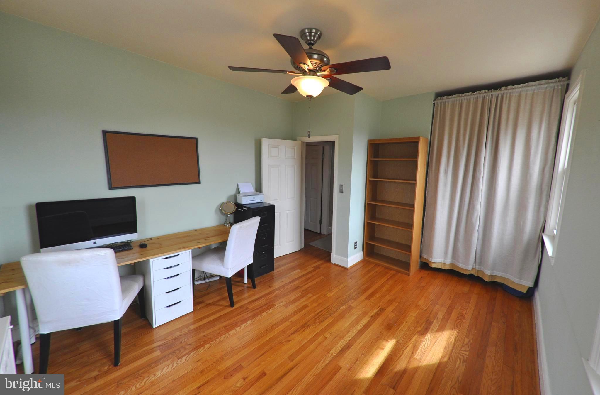 308 Kingston Road Baltimore, MD 21229 - Photo 19 of 30 a workspace with furniture window and wooden floor
