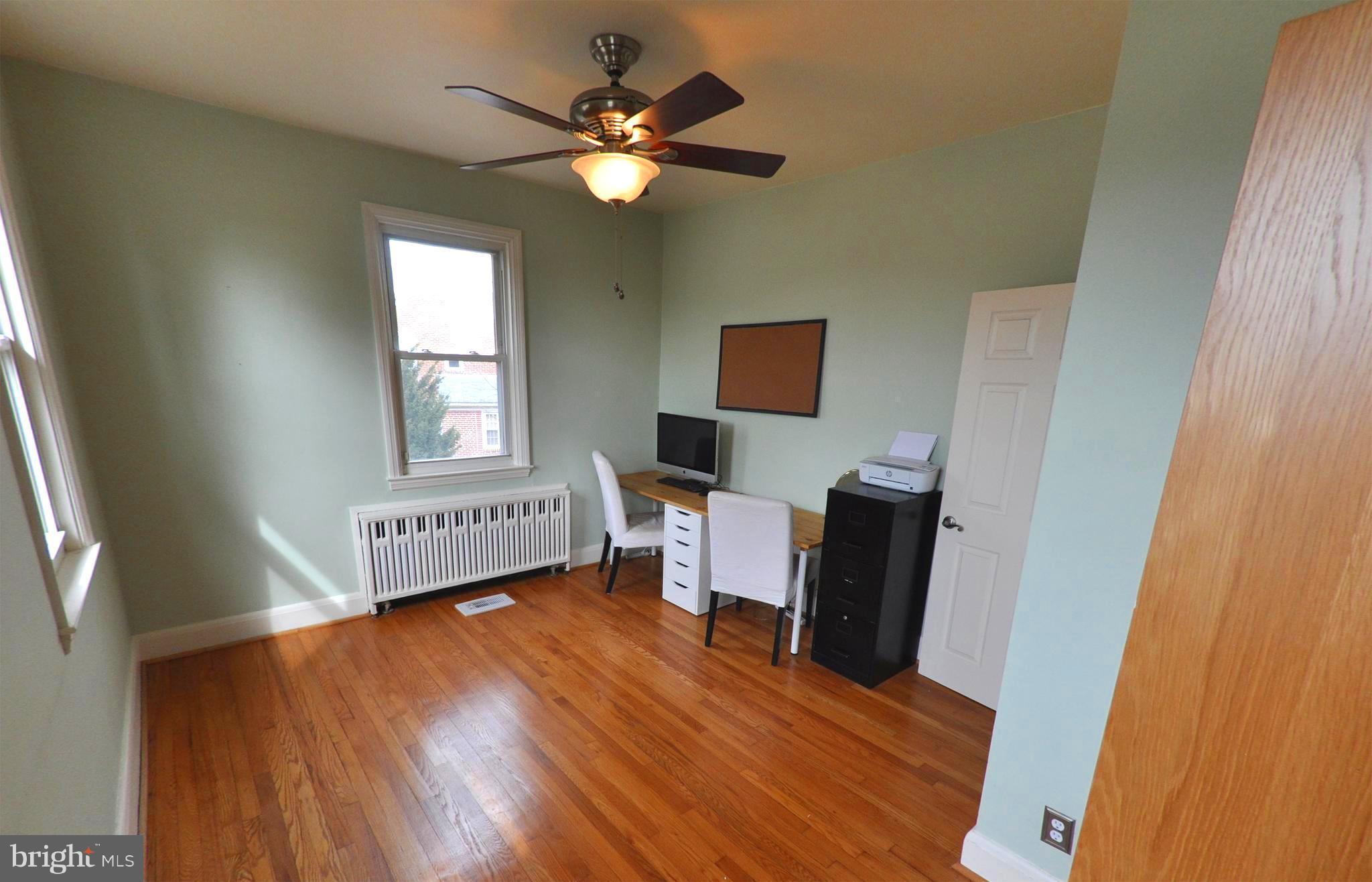 308 Kingston Road Baltimore, MD 21229 - Photo 20 of 30 a view of a workspace with furniture and a window