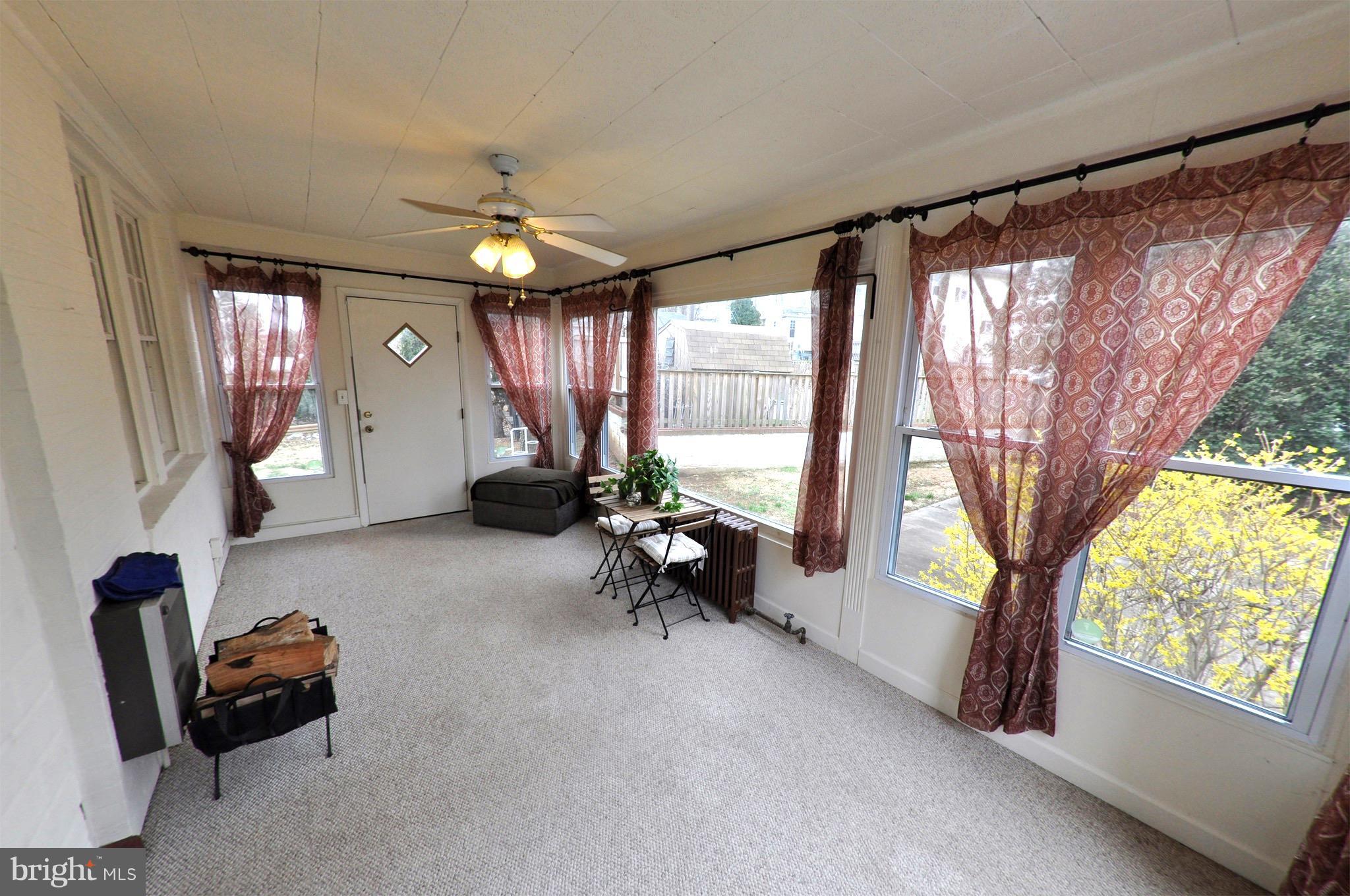 308 Kingston Road Baltimore, MD 21229 - Photo 24 of 30 a living room with furniture and a chandelier