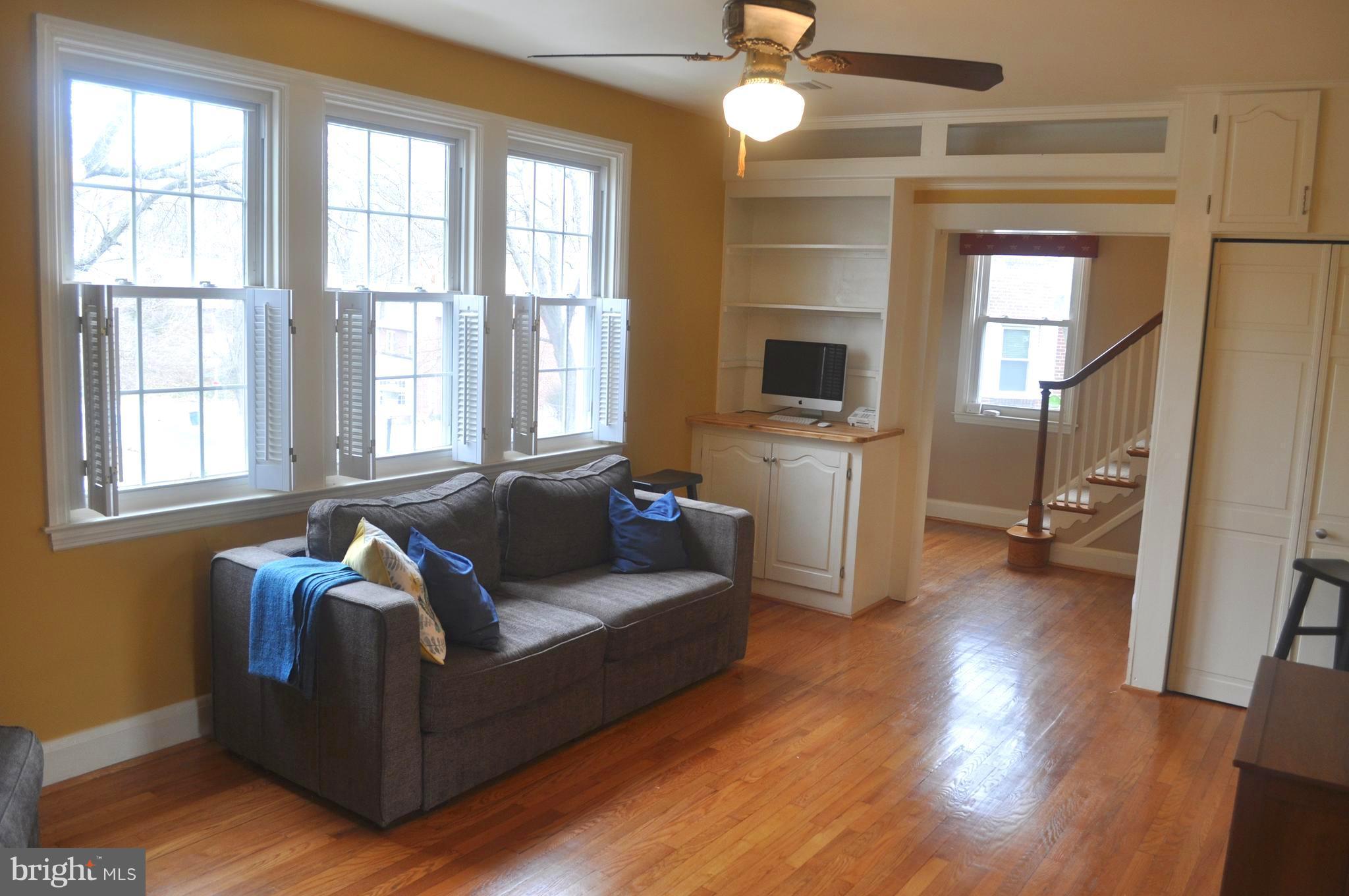 308 Kingston Road Baltimore, MD 21229 - Photo 5 of 30 a living room with furniture and a fireplace