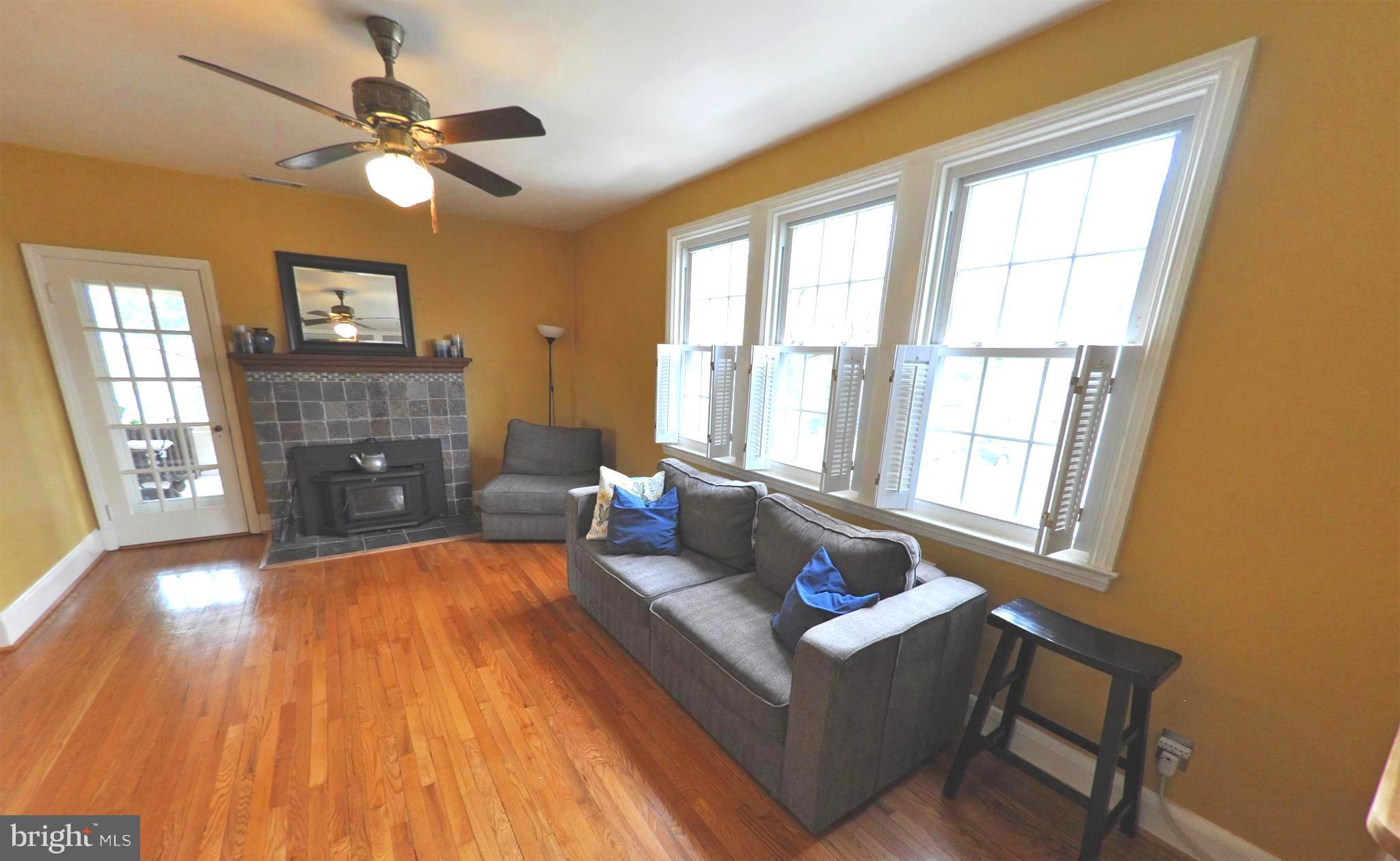 308 Kingston Road Baltimore, MD 21229 - Photo 6 of 30 a living room with furniture and a fireplace