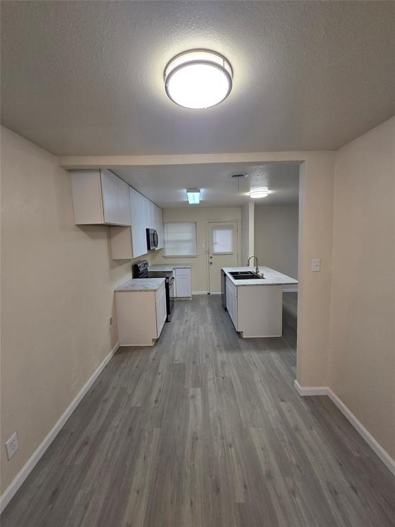 5616 Grassy Ridge Trail Dallas, TX 75241 - Photo 4 of 11 a living room with furniture and a wooden floor