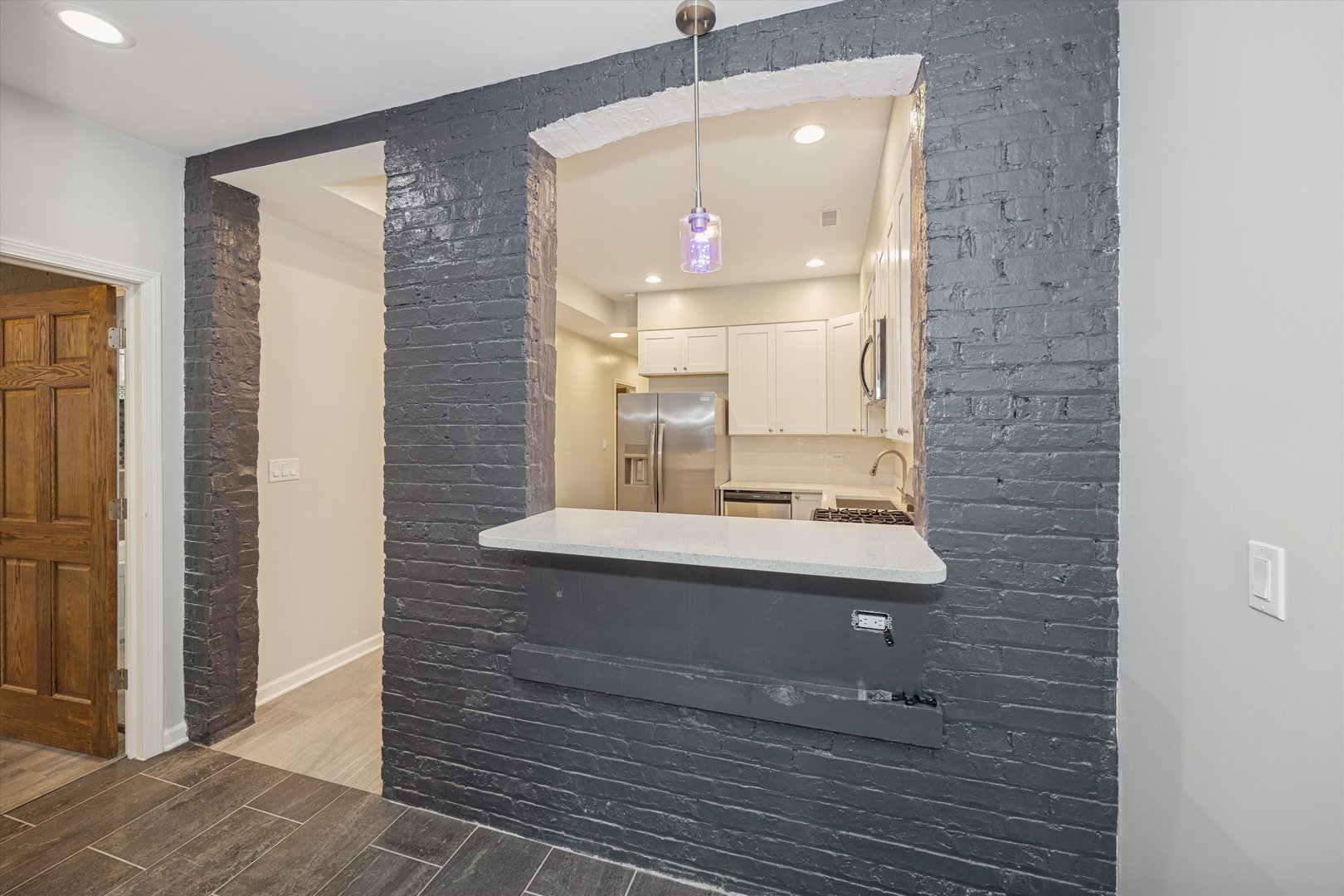 2008 West Addison Street, Unit 2 Chicago, IL 60618 - Photo 6 of 19 a bathroom with a sink shower and a mirror