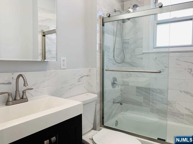 487 Summit Avenue, Unit 2 Fort Lee, NJ 07024 - Photo 16 of 17 a bathroom with a sink toilet and shower